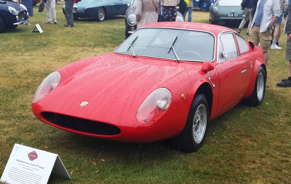 Red Abarth-Simca 2000 GT, front three-quarter view, outdoor concours