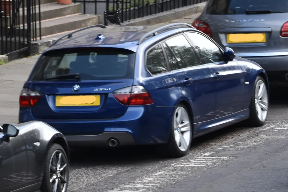 Blue BMW 335d Touring (E91) on an Edinburgh street, rear three-quarter view with the 335d bootlid badge