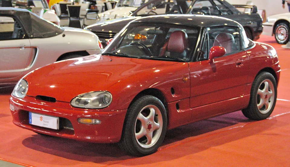Red Suzuki Cappuccino (EA11R) with the hardtop fitted, three-quarter front view