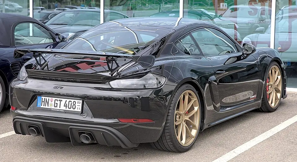 Yellow Porsche 718 Cayman GT4, three-quarter front view