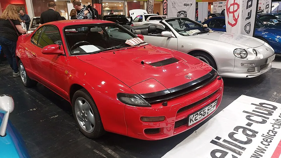 Red Toyota Celica GT-Four ST185 Carlos Sainz Limited Edition, front three-quarter view at an indoor show
