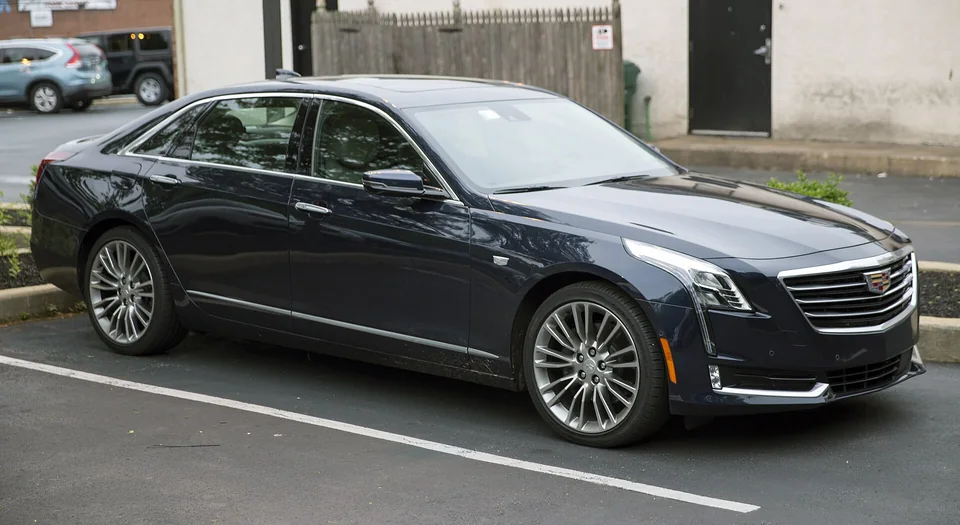 Dark blue 2018 Cadillac CT6 Premium Luxury AWD parked outside an American workshop, three-quarter front view