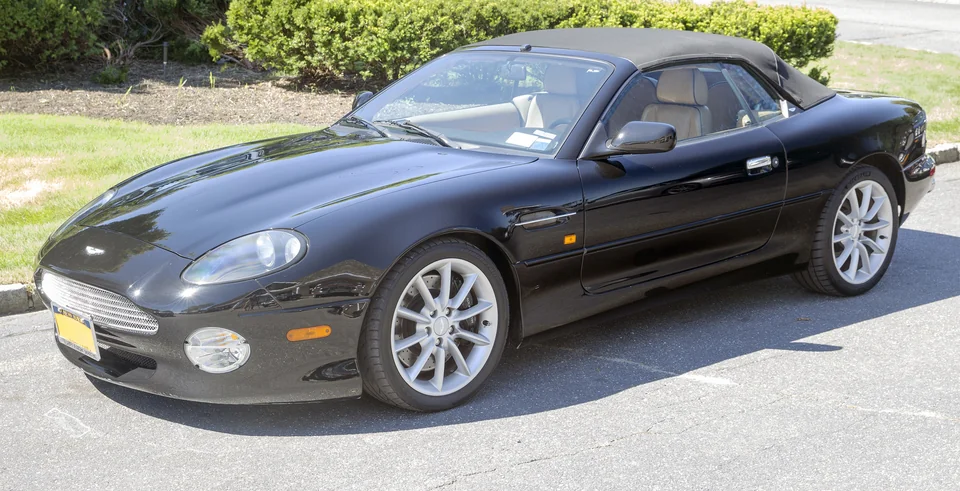 Black Aston Martin DB7 Vantage Volante with the roof up, three-quarter front view