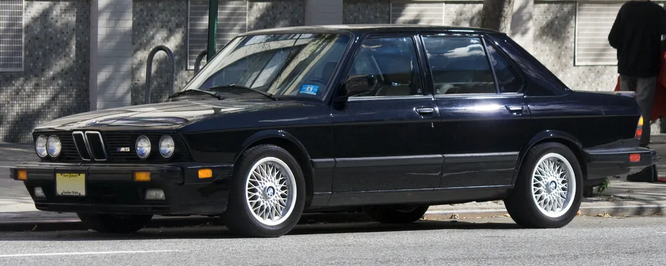 Black BMW M5 (E28), three-quarter front view