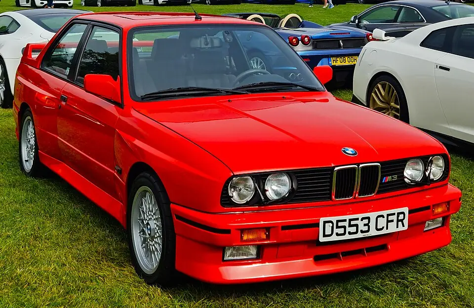 Red BMW M3 E30, three-quarter front view