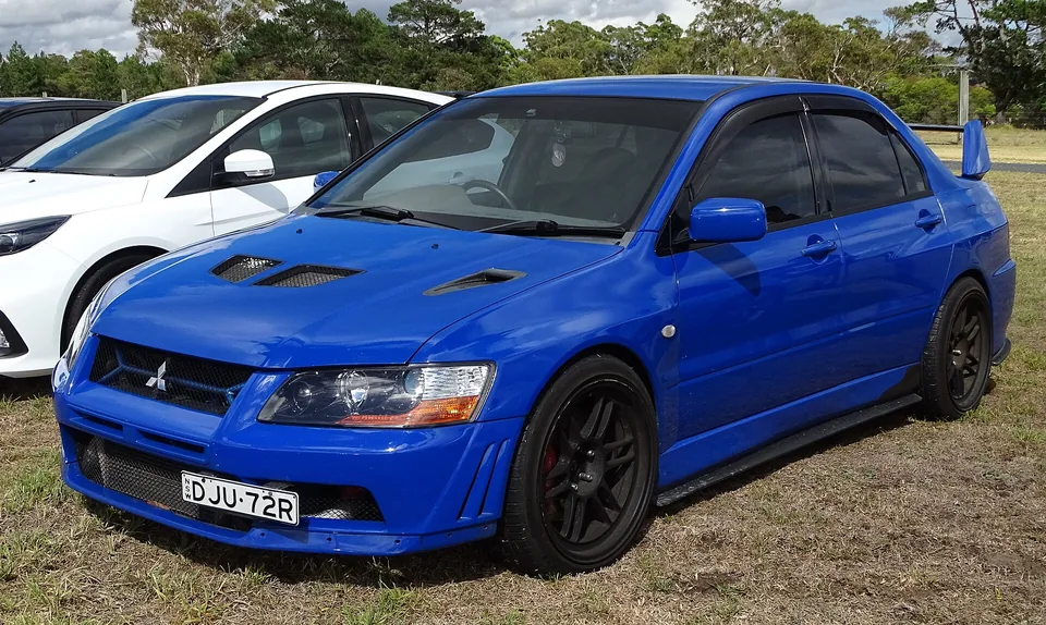 Blue Mitsubishi Lancer Evolution VII (CT9A) saloon, three-quarter front view
