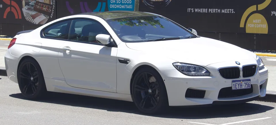 White BMW M6 Coupé (F13) with carbon roof, front three-quarter view