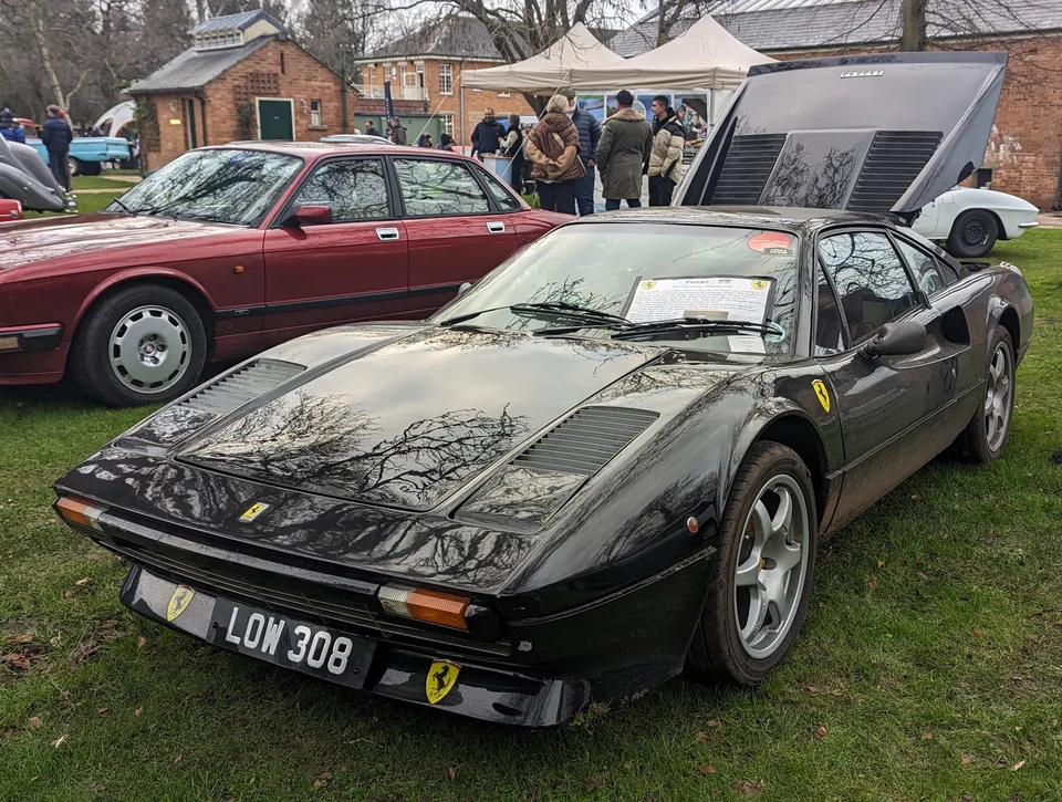 Black Ferrari 308 GTB, three-quarter front view