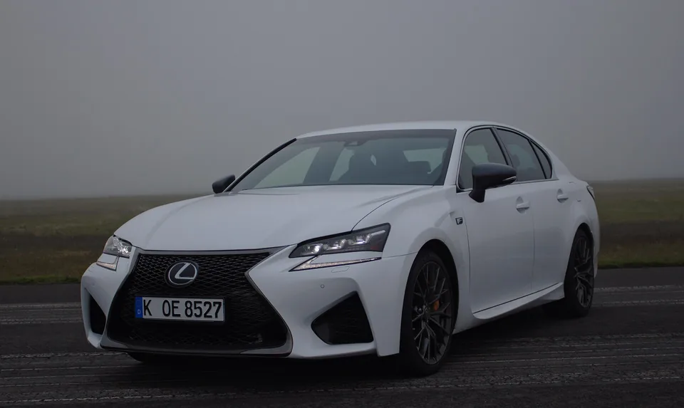 White Lexus GS F, three-quarter front view