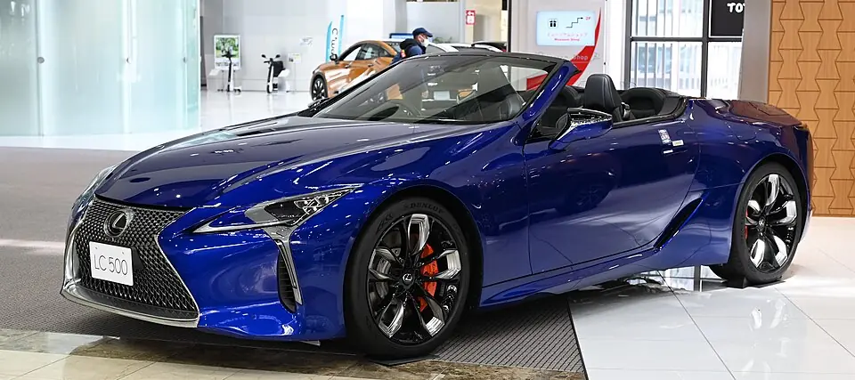 Blue Lexus LC 500 Convertible with top down, three-quarter front view
