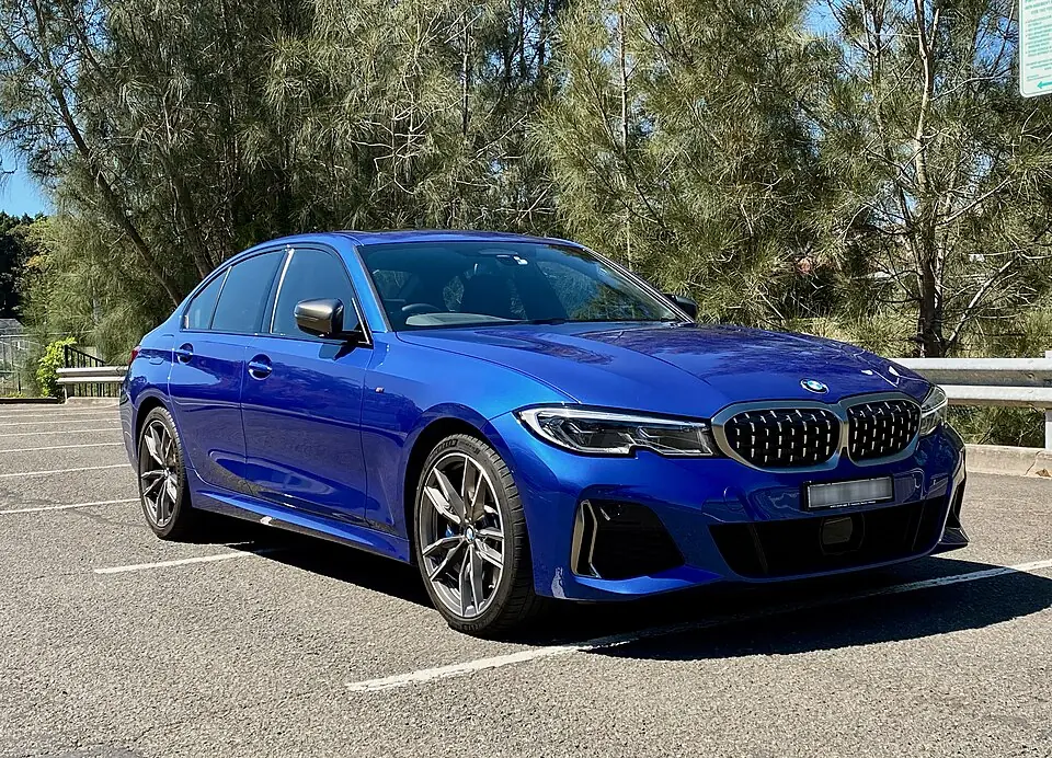 Blue BMW M340i, three-quarter front view
