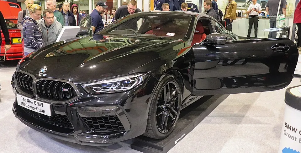 Black BMW M8 Competition Coupe, three-quarter front view