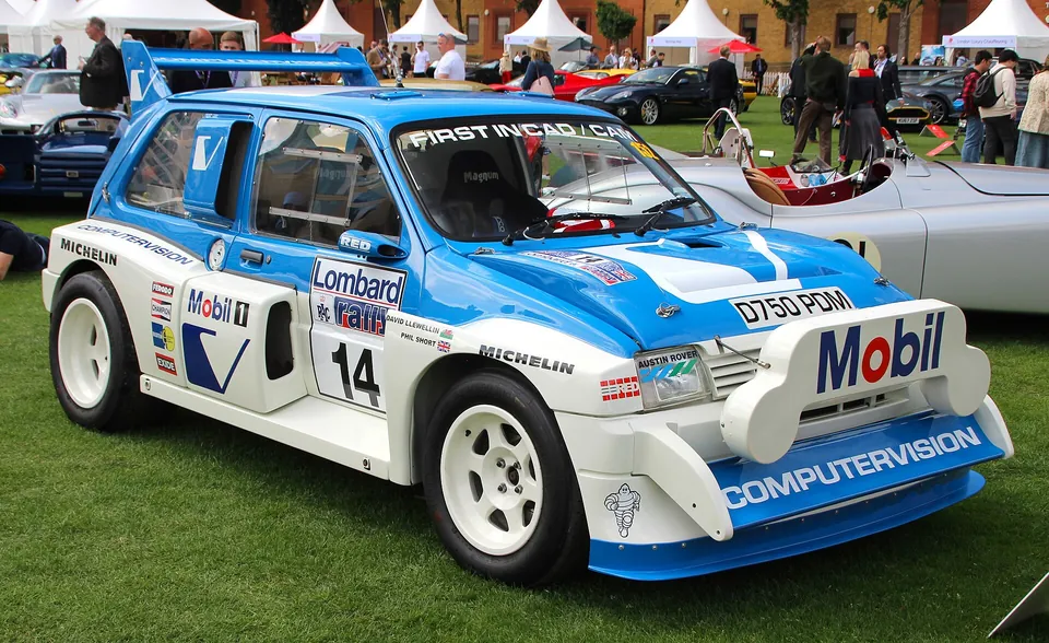 Blue and white MG Metro 6R4 in rally livery, front three-quarter view