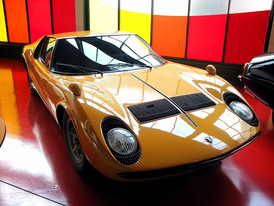 Gold Lamborghini Miura, front three-quarter view, museum display