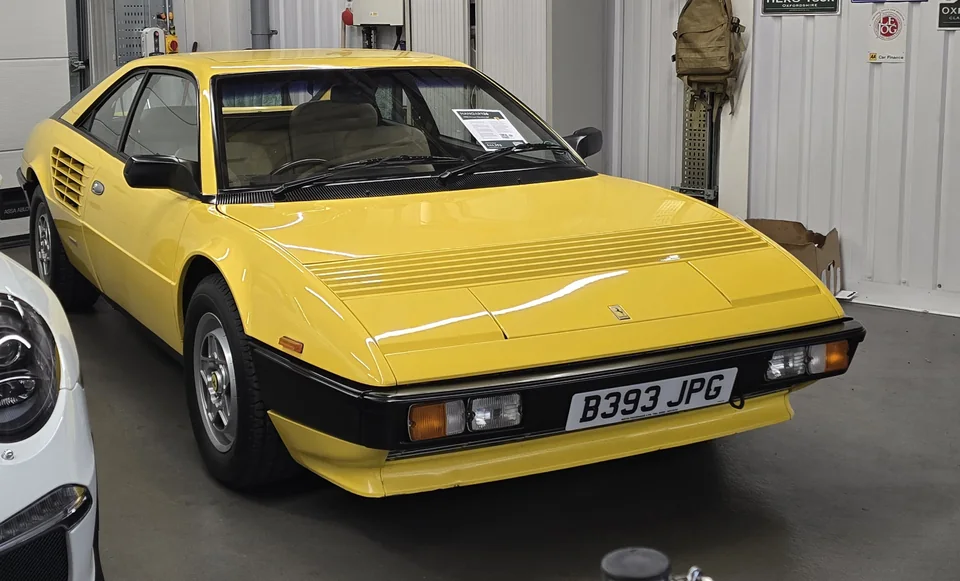 Yellow Ferrari Mondial QV, three-quarter front view