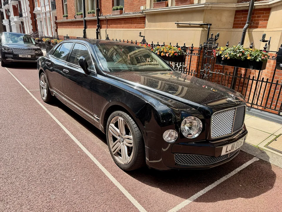 Black Bentley Mulsanne parked on a London street, three-quarter front view