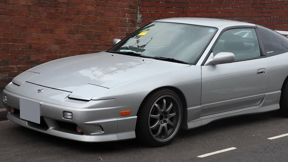 Silver Nissan 180SX fastback, three-quarter front view