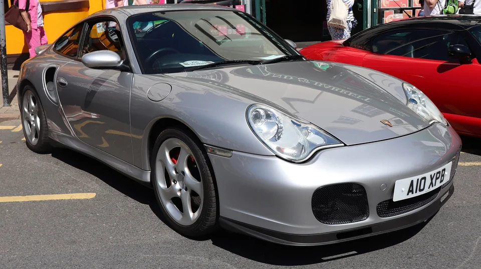 Silver Porsche 911 Turbo (996) at a British car show, three-quarter front view