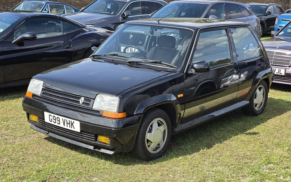 Black Renault 5 GT Turbo, front three-quarter view on grass