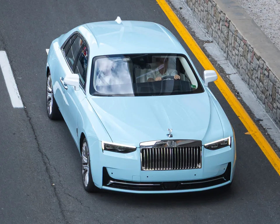 Pale blue Rolls-Royce Ghost (II), three-quarter front view from above