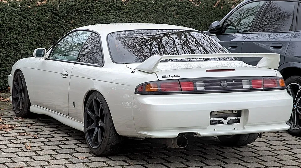 Blue Nissan Silvia S14, three-quarter front view