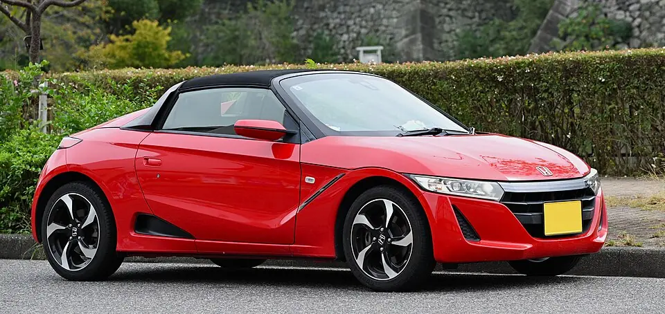 White Honda S660 kei roadster, three-quarter front view