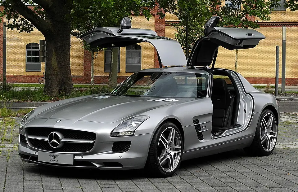 Silver Mercedes-Benz SLS AMG with gullwing doors open, front view