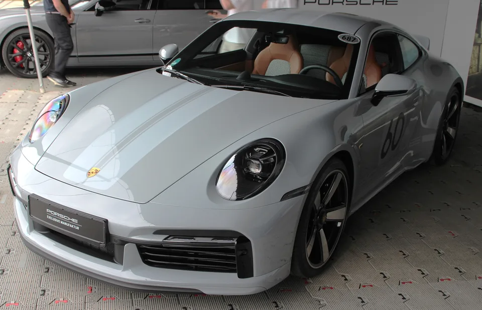 Sport Grey Porsche 911 Sport Classic (992) with double-bubble roof, three-quarter front view