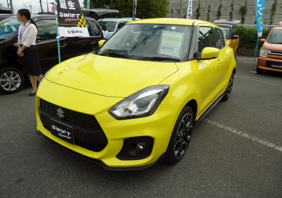 Yellow Suzuki Swift Sport (ZC33S), three-quarter front view