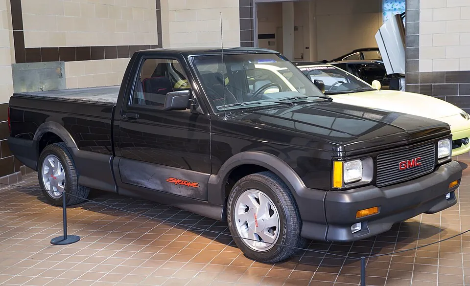 Black GMC Syclone pickup, three-quarter front view