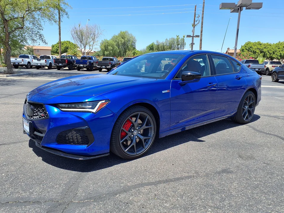 Blue Acura TLX Type S on an Arizona forecourt, three-quarter front view