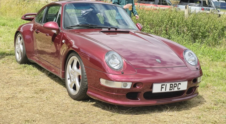 Burgundy Porsche 911 Turbo (993), three-quarter front view