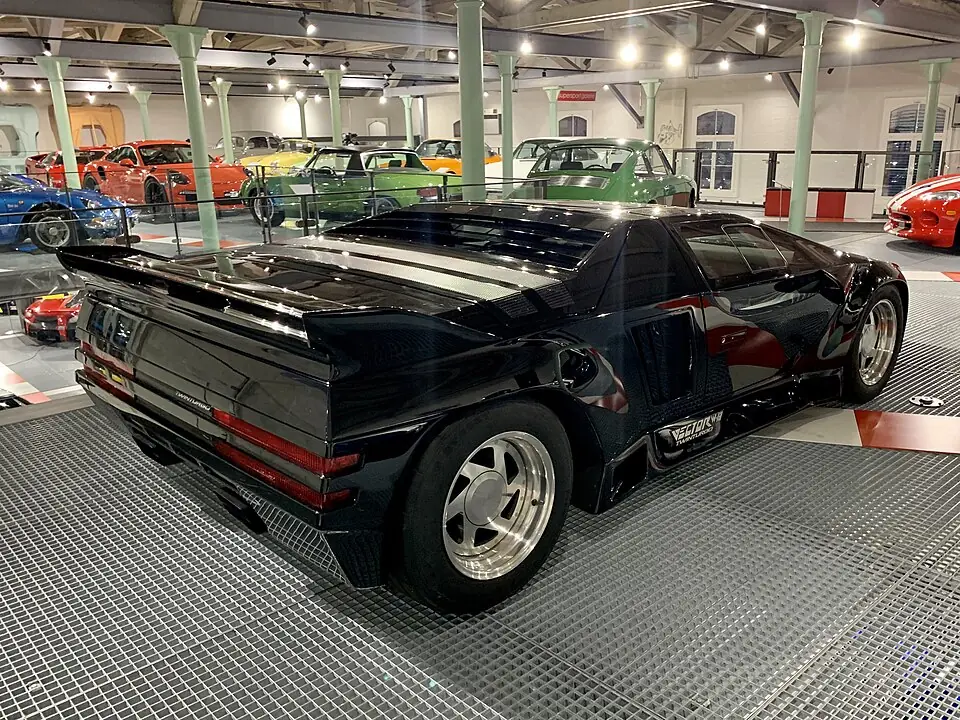Black Vector W8, three-quarter rear view