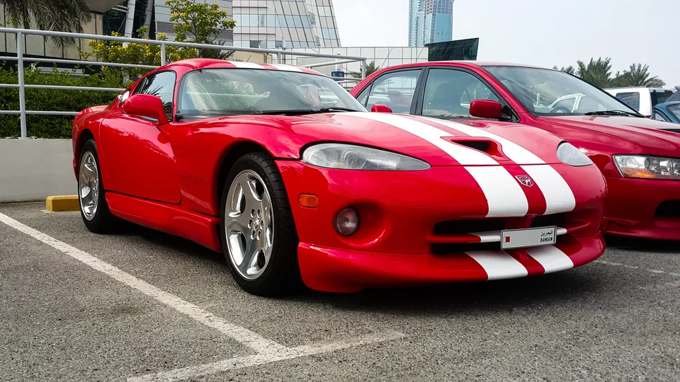 Red Dodge Viper GTS with white stripes, front three-quarter view