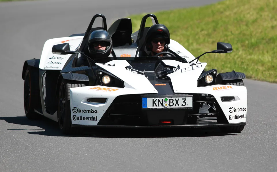White KTM X-Bow on a mountain road, front view