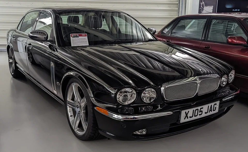 Black Jaguar XJ Super V8 (X350) in a British showroom, three-quarter front view