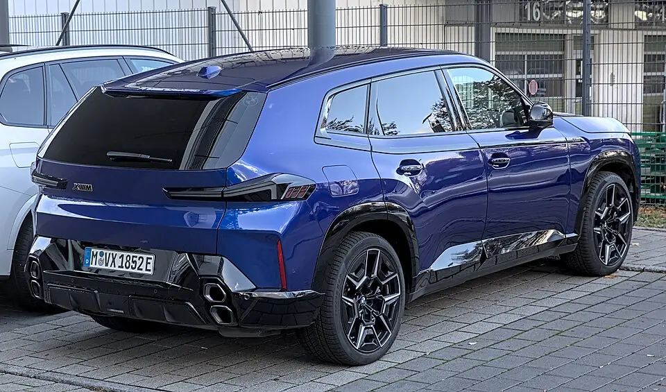Dark blue BMW XM, rear three-quarter view